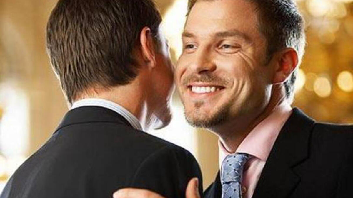 greeting a man with a kiss