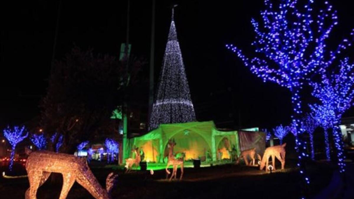 A Christmas tree and ornaments decorate a park in the Beirut suburb of Sin el-Fil.