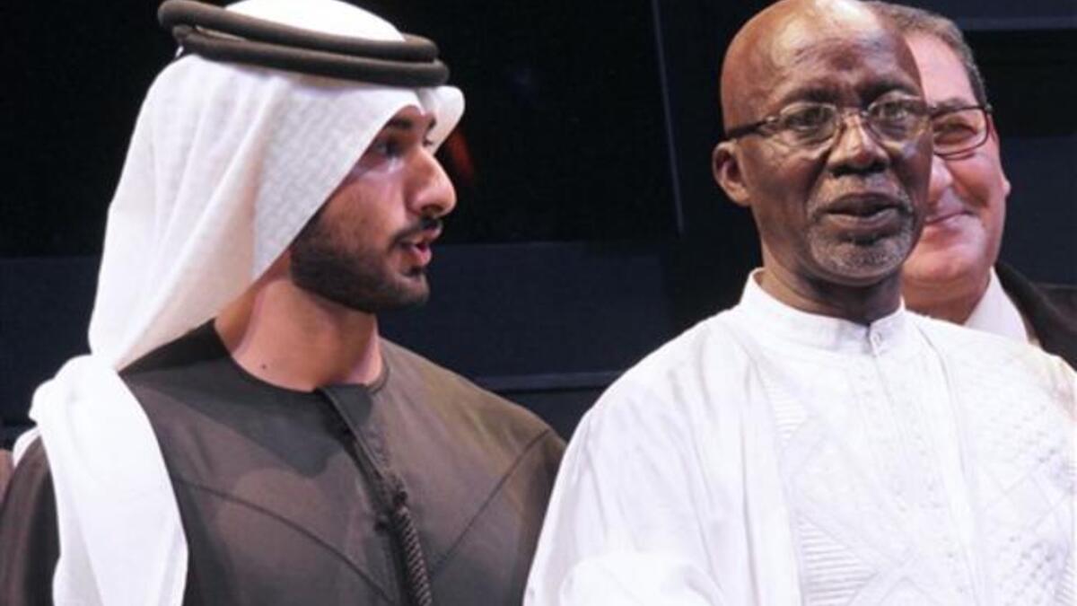 Malian director Souleymane Cisse (R) poses next to Sheikh Majid bin Mohammed bin Rashed al-Maktoum.