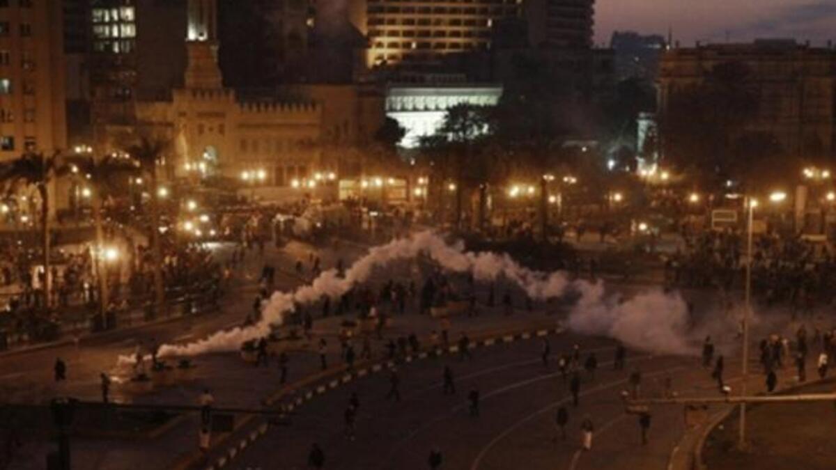 Tear gas fired by Egyptian police is seen during a protest in central Cairo in which demonstrators demanded the ouster of President Hosni Mubarak.