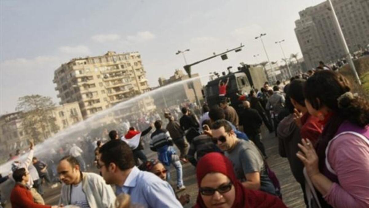 Egyptian police use water canon to disperse demonstrators during clashes in central Cairo.