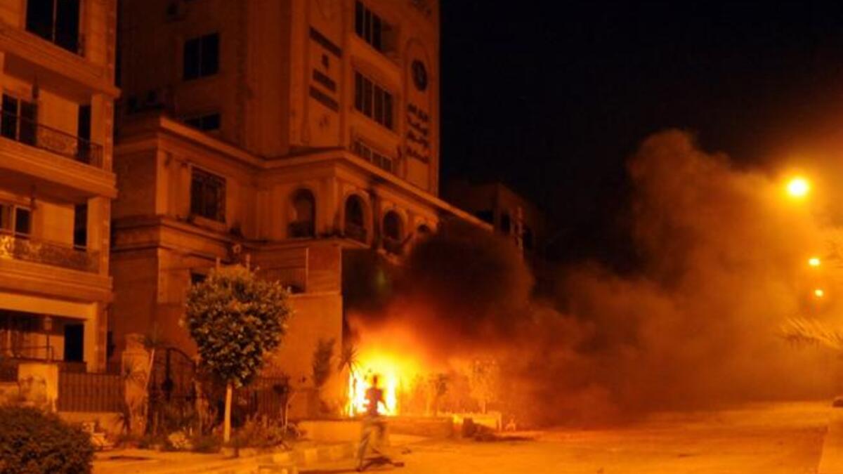 Things get heated as protestors set fire to the Muslim Brotherhood HQ (AFP)