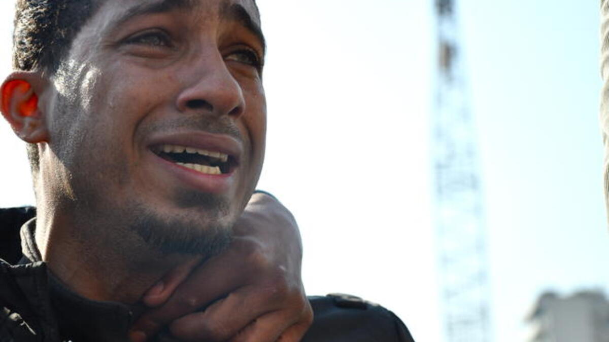 Tears for the suffering of his country- after years of frustration and pent up but erstwhile silent rage, this man is overwhelmed by the intensity as he opens the floodgate for tears of a nation united in emotion.