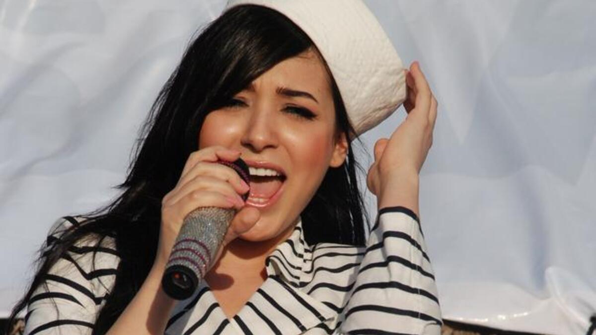 Sandy sings her latest at the "Mika al Ajamy" show and the fans request an 'encore' (or repeat) of  hit single "Hasal Khai".