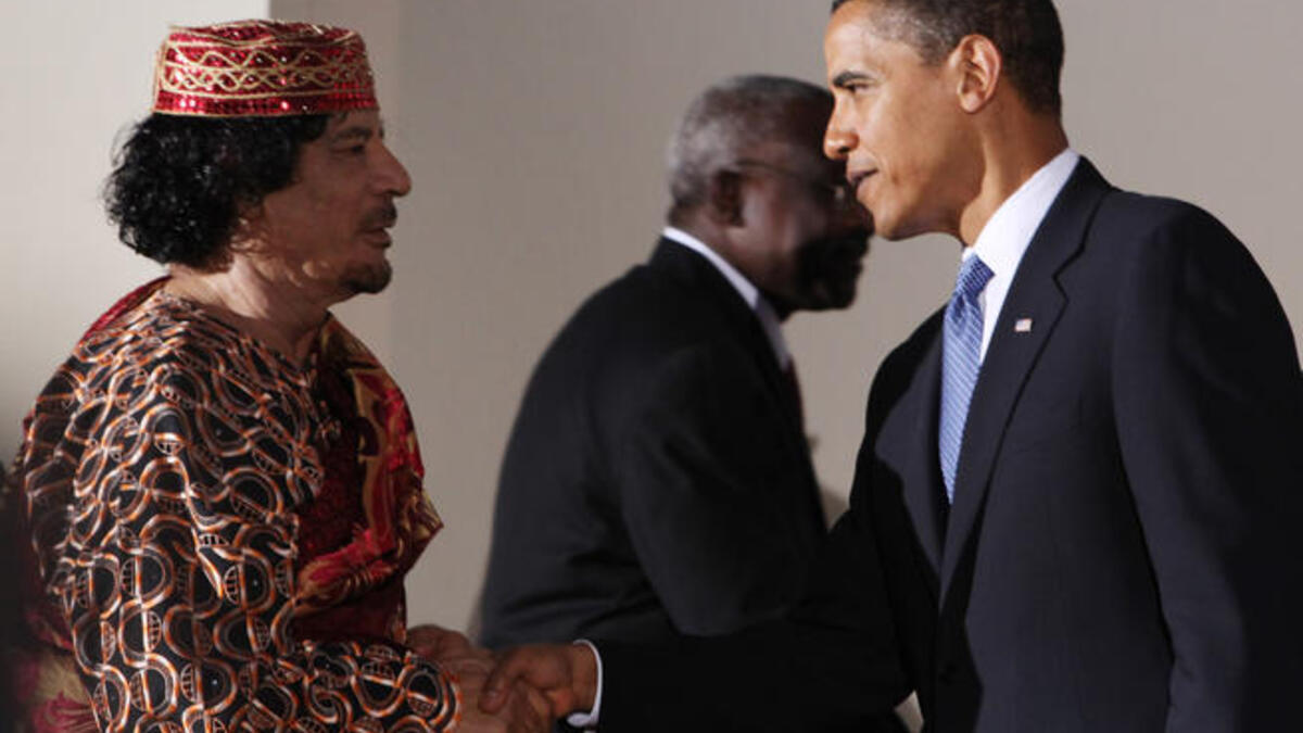 Other world leaders are not immune to the charms of this bizarre personality : Gaddafi shakes hands with U.S. President Barack Obama during the G8 summit on July 9, 2009 in L'Aquila, Italy.