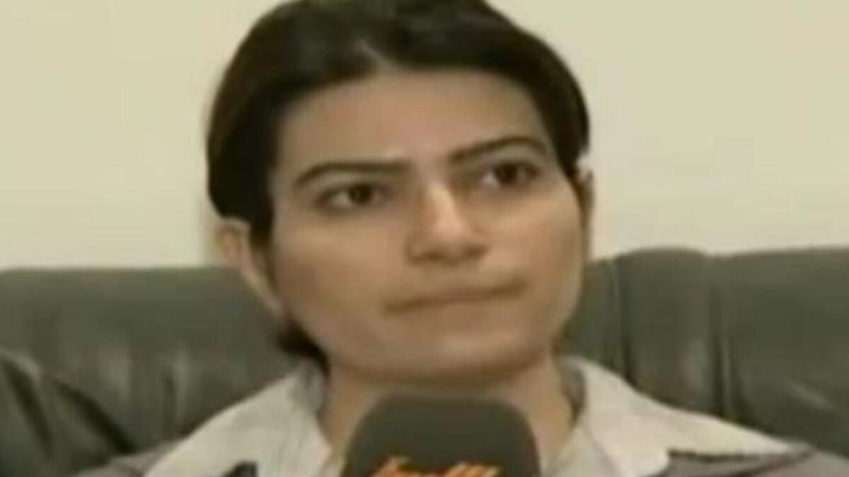 Making her mark as an investigator for the Libyan state: She subjected a state-arrested female Syrian journalist to an interrogation on her soliciting with the opposition forces.