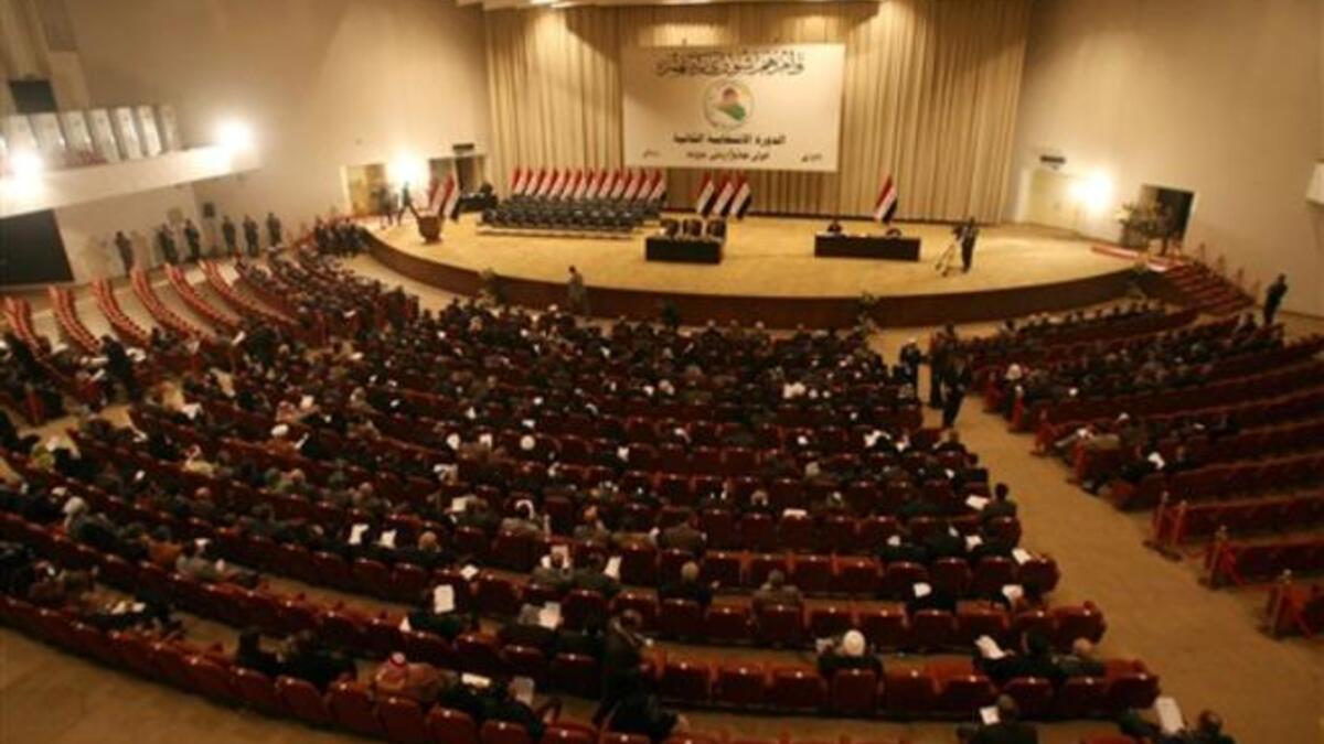 Iraqi MPs are seated in parliament in Baghdad on December 21, 2010 as lawmakers gave Prime Minister Nuri al-Maliki's government a vote of confidence and adopted a 43-point program aimed at liberalizing the economy and fighting terrorism.