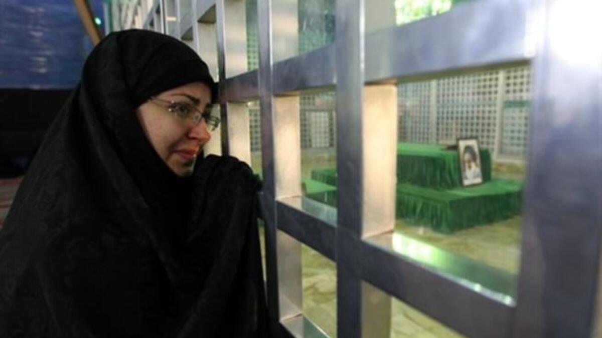 An Iranian woman visit the shrine of Ayatollah Ruhollah Khomeini, the late founder of the Islamic republic.