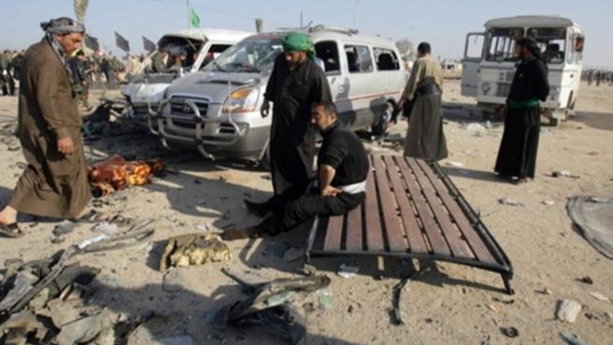 People gather on the site of an explosion.