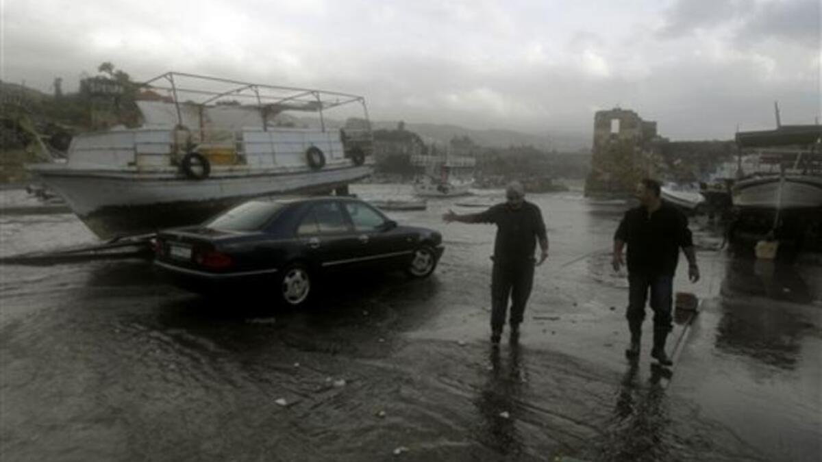 Lebanese fishermen check their boats in the ancient northern port of Byblos.