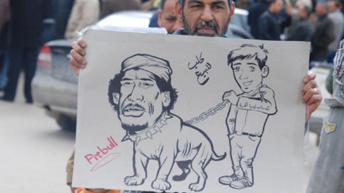 The leader may have labeled his people as cockroaches, cats and mice, but the people spit back the most notorious of insults with &#039;dog&#039;.