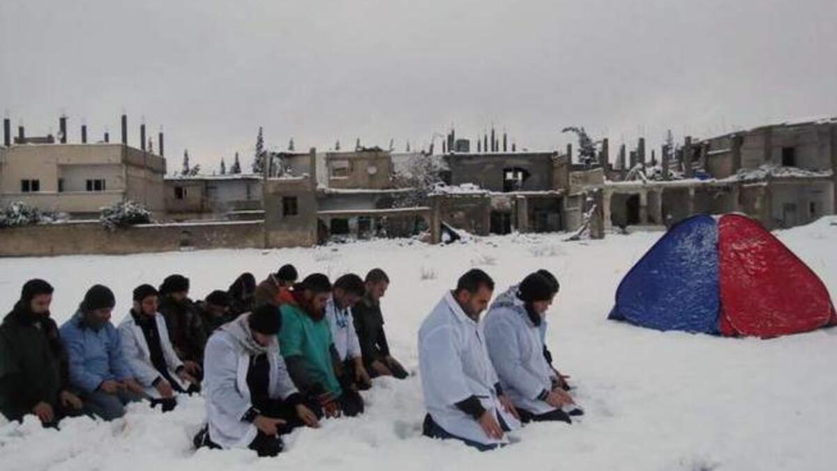 Syria's snow with medics in Homs at prayer