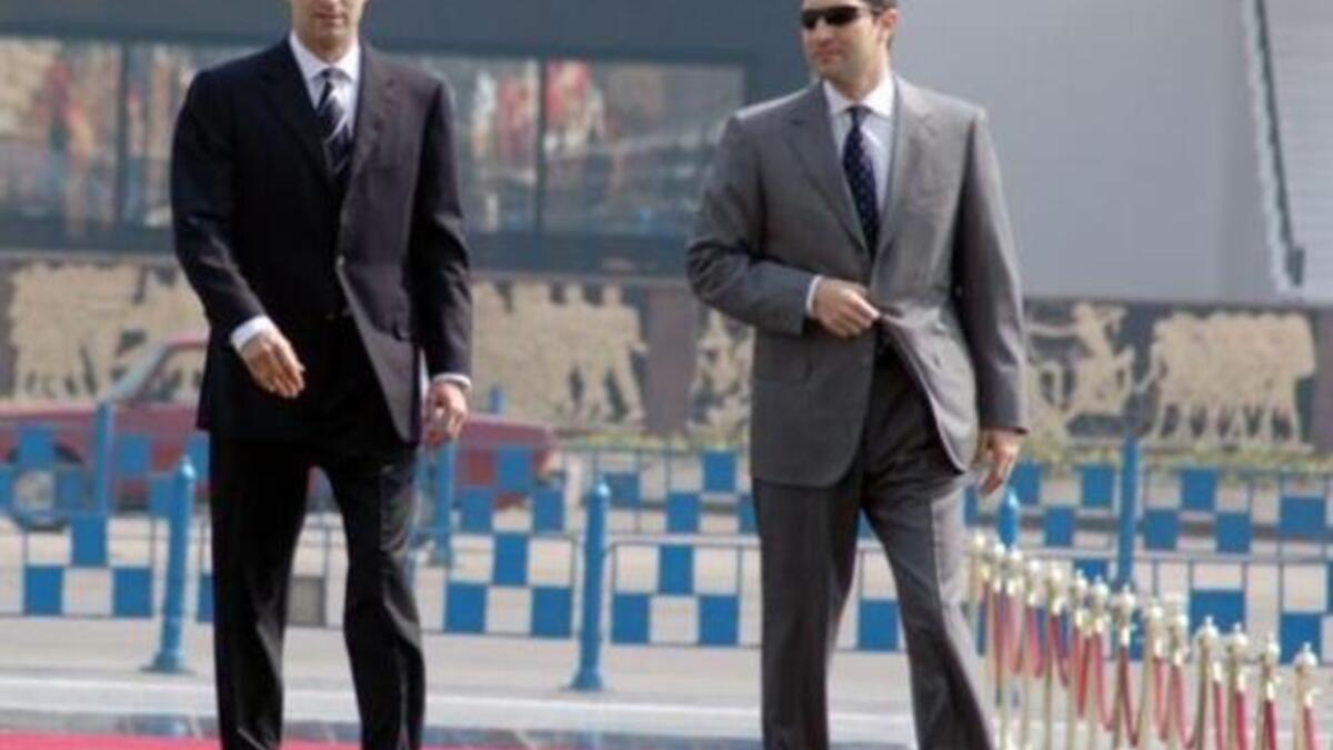 Ala’a Mubarak (R), clad in white suit, not the zebra striped outfits we expect, nor the orange jumpsuits of other notorious jails. Brothers now housed in Tora jail. Mock-called Tora-Bora in ref to the Afghani caves.