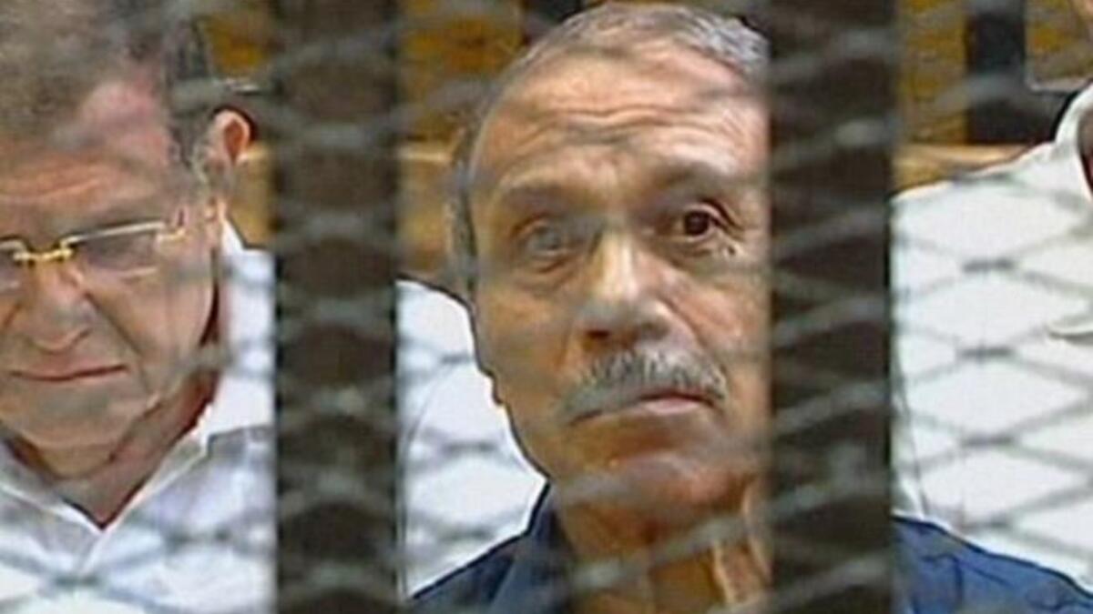 Egyptian former interior minister Habib al-Adly sits in a holding cell in the Cairo Criminal Court on the outskirt of the capital.