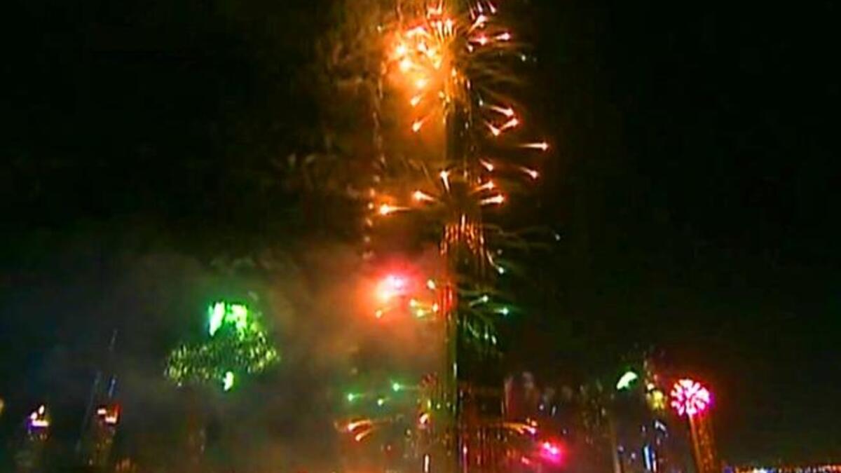 Burj Khalifa goes up in flames-- of the pyrotechnic variety-- in an impressive display of light to welcome in the New Year, 2012.