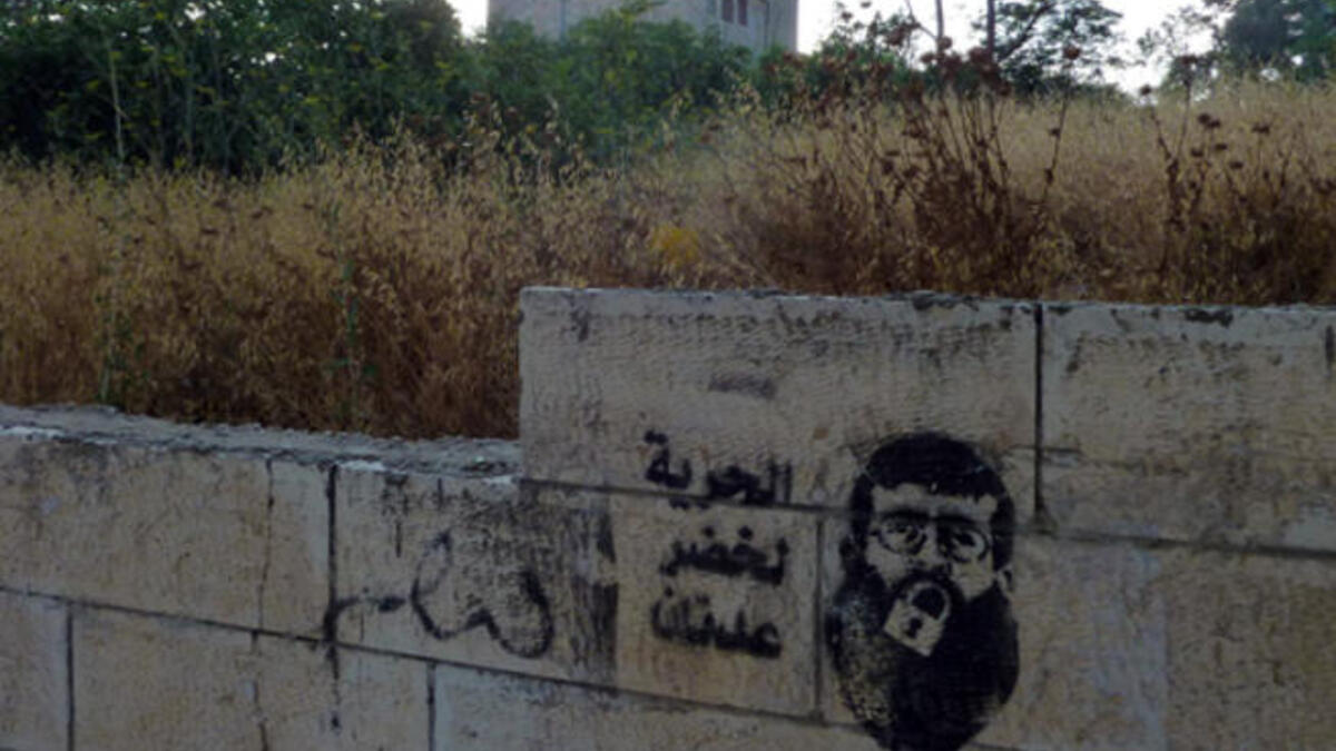 Khader Adnan represented in Palestinian graffiti