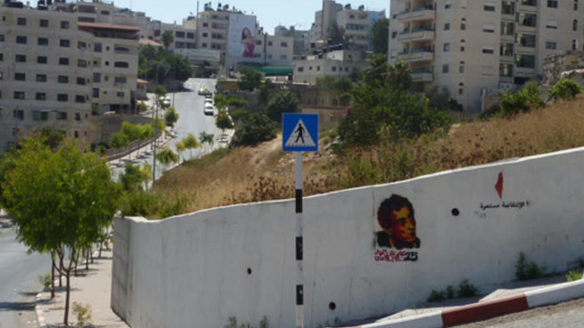 Naji el-Ali and Handala graffiti on a Ramallah wall by Palestinian street artist