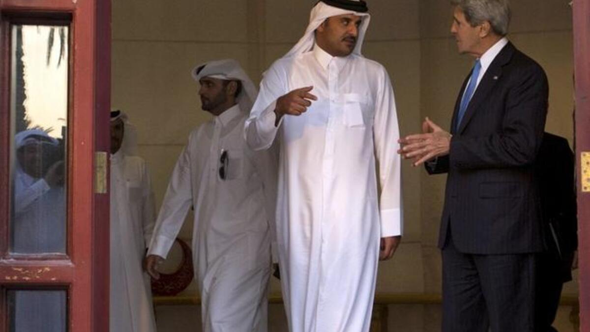 U.S. Secretary of State John Kerry (R) meets with Sheikh Tamim bin Hamad al-Thani (C) at the Crown Prince's home, the Sea Palace, in Doha (AFP)