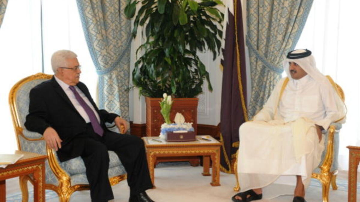 Palestinian President Mahmoud Abbas (L) meets Sheikh Tamim bin Hamad on February 6, 2012 in Doha, Qatar (Getty)