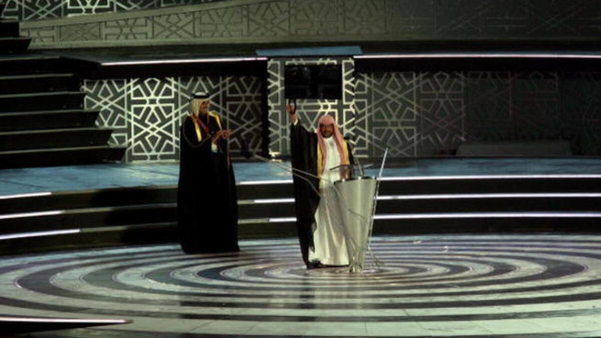 Sheikh Tamim Bin Hamad Al-Thani (R), the Heir Apparent & Chairman of the Board of Directors, DAGOC waves to the crowd during the Closing Ceremony of the 15th Asian Games Doha (Getty)