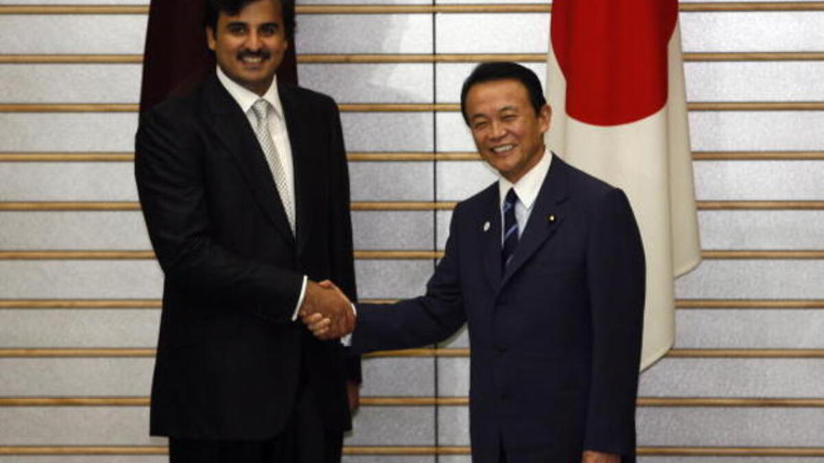 Sheikh Tamim Bin Hamad Al Thani is greeted by Japanese Prime Minister Taro Aso before a meeting in Tokyo (Getty)