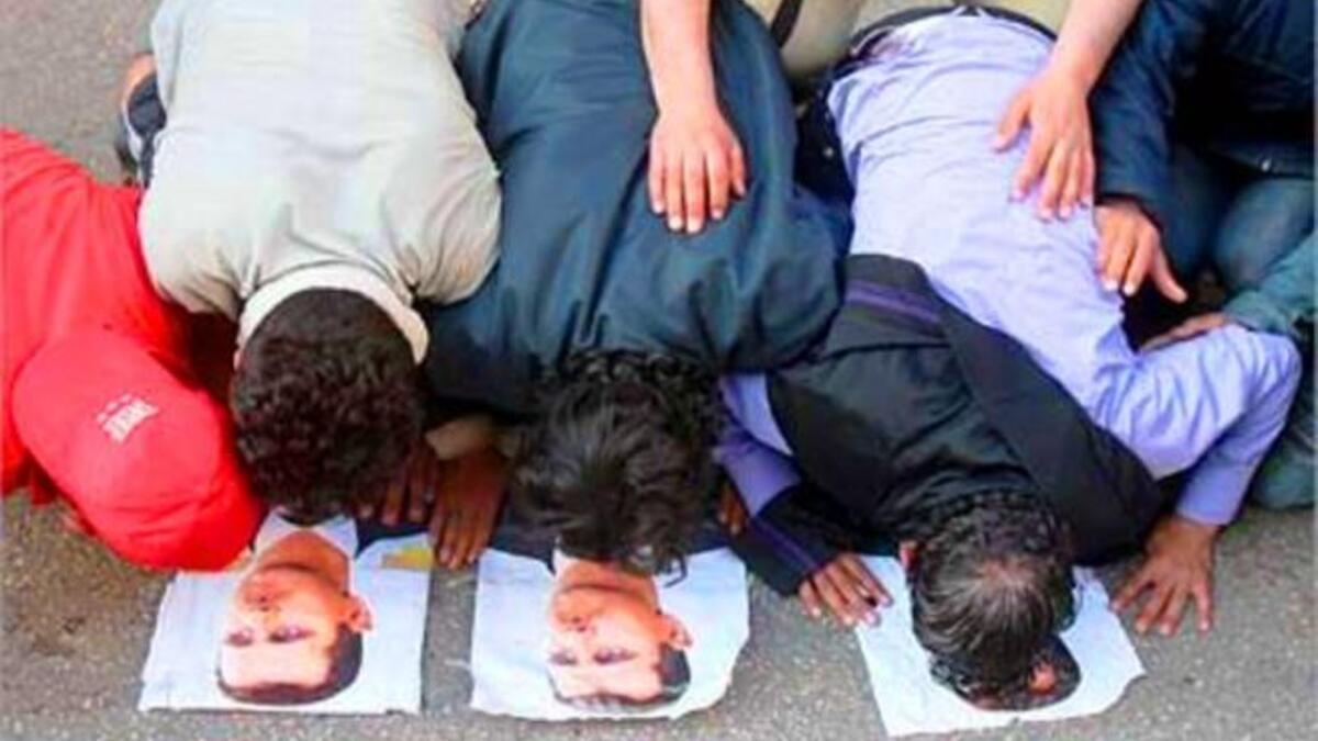 More Mosque Massacres: Reports are rife of worshipers under attack as they 
left their mosques. One witness, Hamawi, said buses packed with soldiers and police surrounded every mosque in Hama. Crowds chanted, "We will not kneel."- implying their supplication was to God alone, and that Syria's regime could no longer rule them by force.