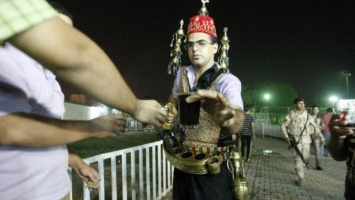Iraq, Baghdad: An Iraqi serves Ramadan drinks (Jallab -a date juice, with grape molasses and rose water served with raw pine kernels), while mid-Ramadan news of 7 pulled from a south Baghdad, Sunni mosque, and killed execution-style breaks in this sacred month.