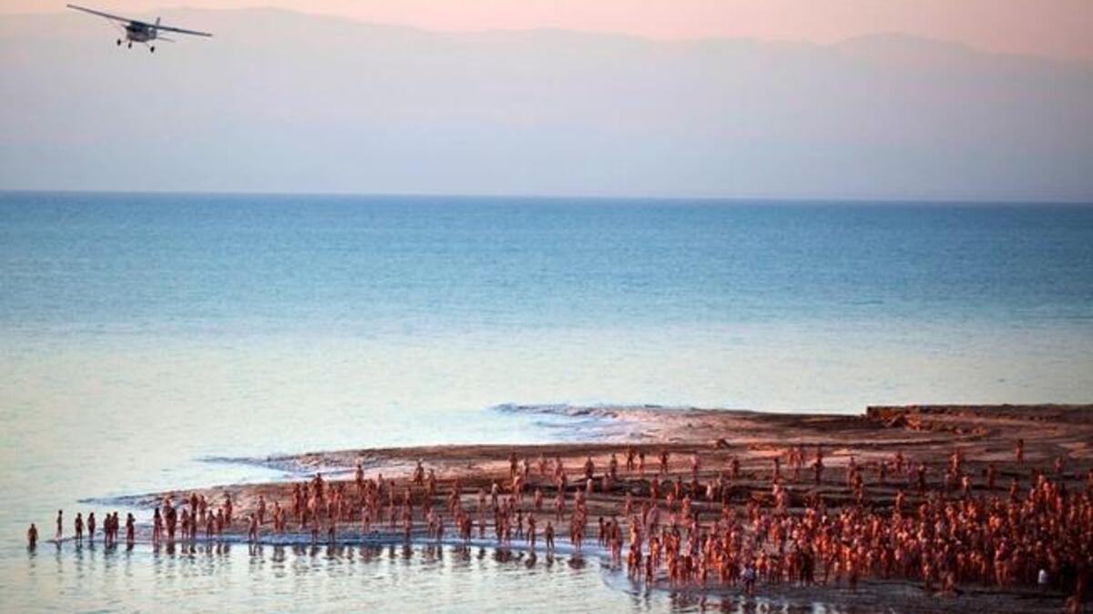 Has the exemplar of the chosen faith, Israel, fallen from grace? If Sharon surfaced, he'd learn of the 'depravity' of his 
compatriots who recently got naked in the name of (Holy Land) art. Much to the dismay of the religious right, a 'tribe' of 1,000 chosen
Israelis took part in Spencer Tunick's mass nude shoot in the Dead Sea.