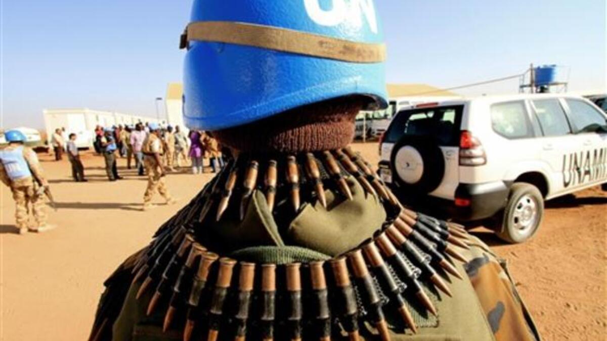 UN peace keepers secure the area as Qatari Minister of State for Foreign Affairs Ahmed bin Abdullah al-Mahmud arrives in Darfur.
