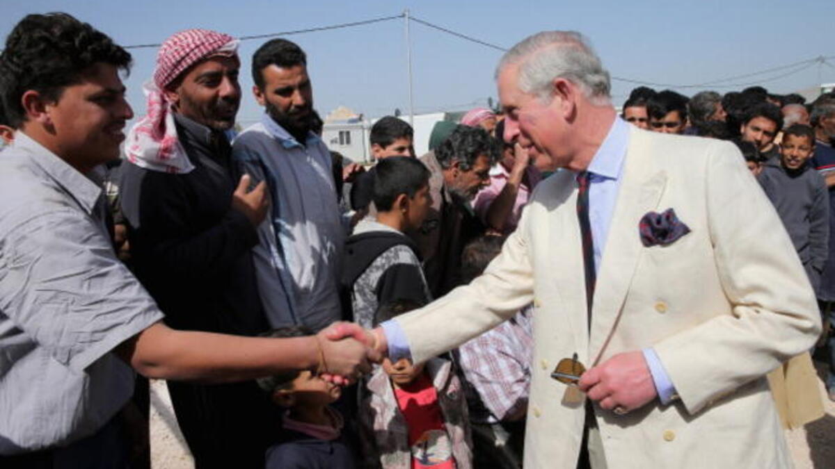Prince Charles meets refugees at a camp
