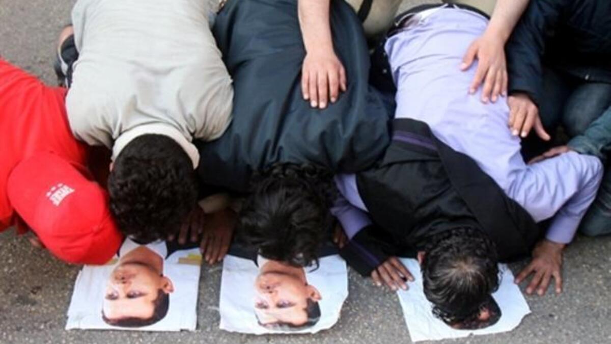 This rather is the more common site expected to be witnessed in Syria. Kissing the President’s likeness, though whether voluntarily or not is in question here.