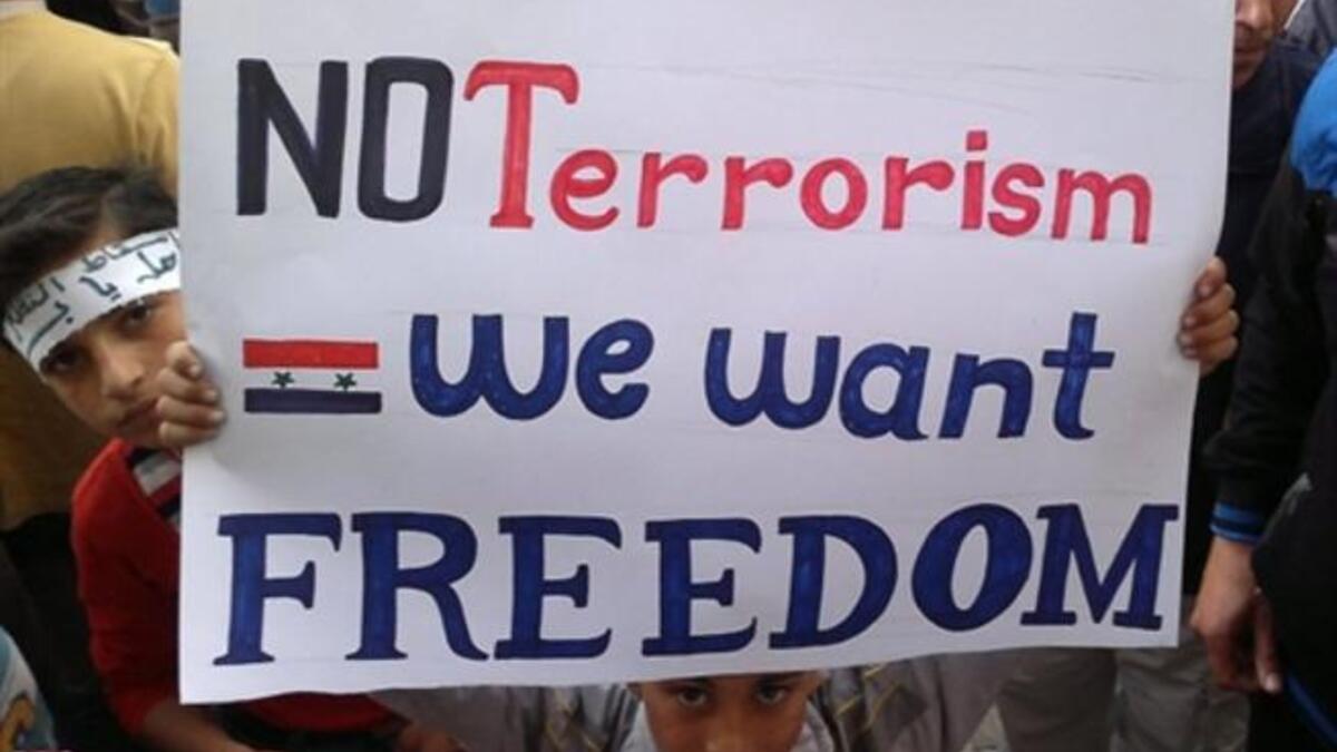 Banias Boy: Other banners witnessed bear the words in Arabic: "Mother, prepare my shroud, the Syrian people aren't cowards" .