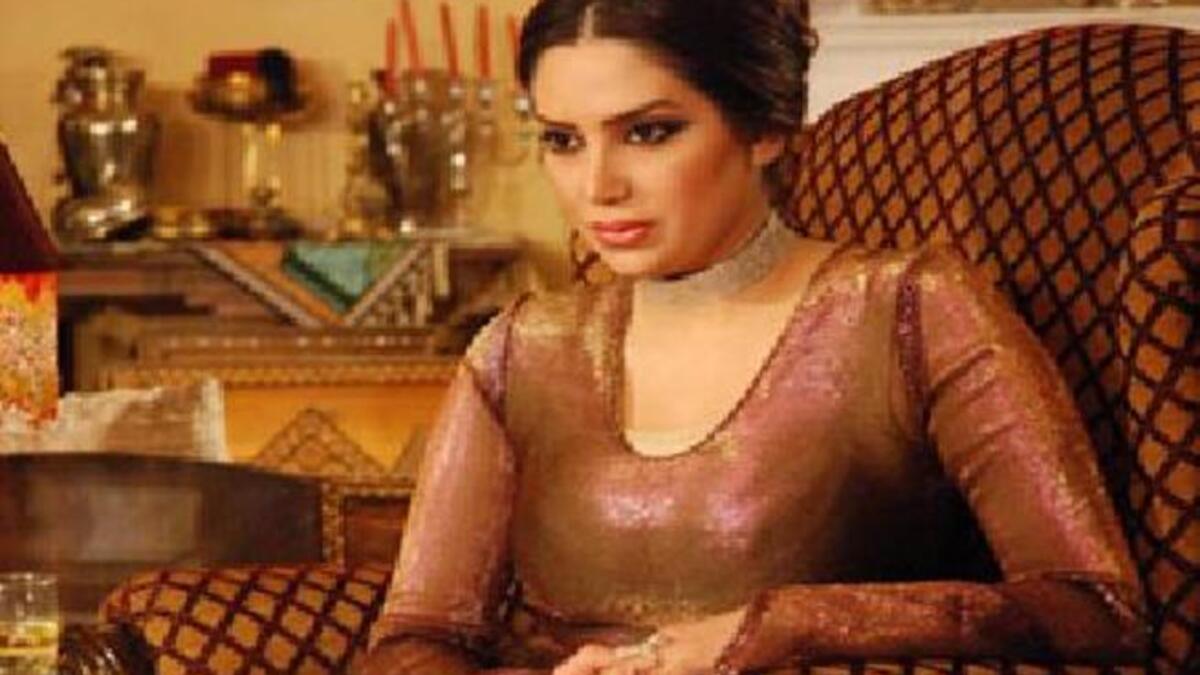 This regal Syrian actress takes her seat.