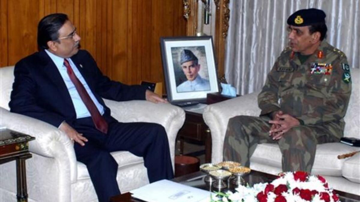 Pakistani Army Chief General Ashfaq Kayani (R) talking with Pakistan’s President Asif Ali Zardari. Leaked memos exposed deep tensions between the United States and Pakistan on nuclear arms safety, and revealed how the army considered forcing out a president who dreads his own assassination.