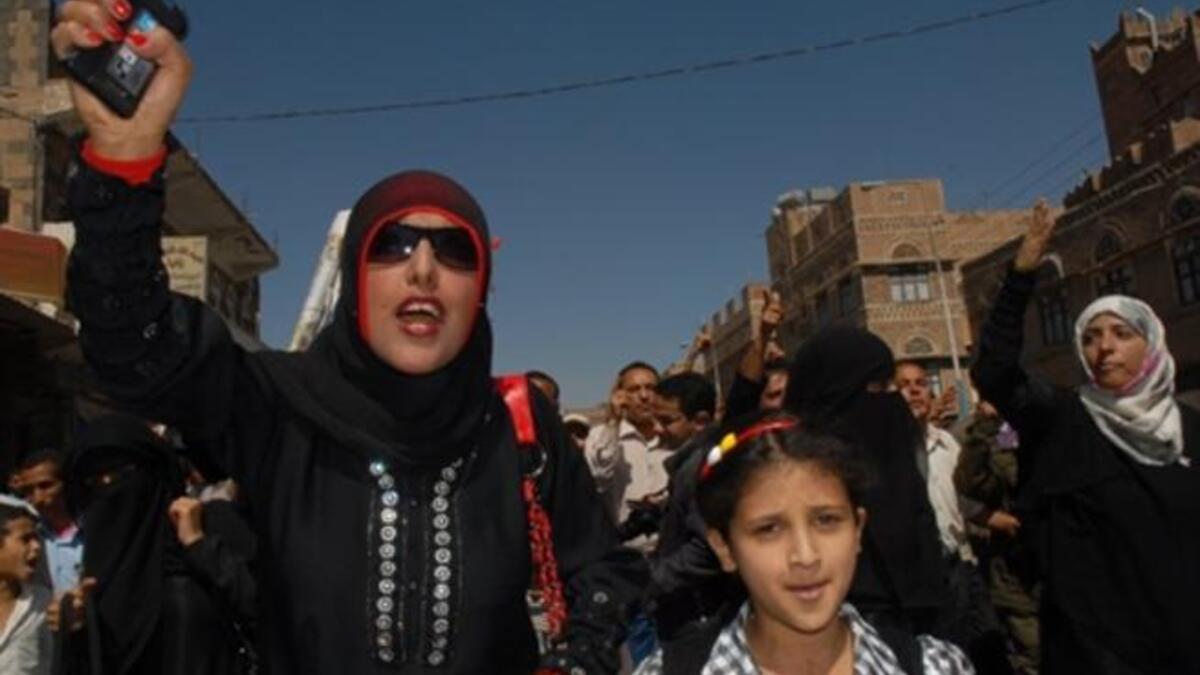 Tawakel Karman (R), who heads a rights group, joins a protest calling for the ouster of Yemen's President Ali Abdullah Saleh.
