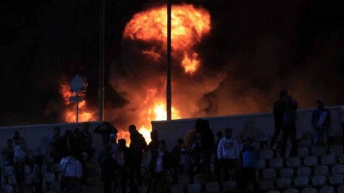 Flames rise from Cairo Stadium early in the match, Zamalek v. Ismaili clubs. Port Said has had wide repercussions just a day after, with Al Ahly Portuguese coach quitting, Port Said's governor resigning & the PM sacking officials from the EFA board. Top clubs Zamalek & Ahly have been disqualified, as well as the Premier League being suspended.