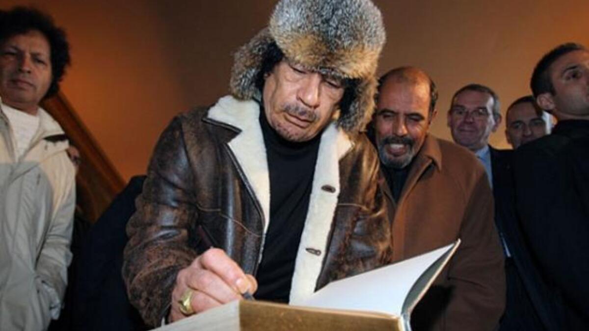 Brandishing yet another exorbitant hat for the occasion.