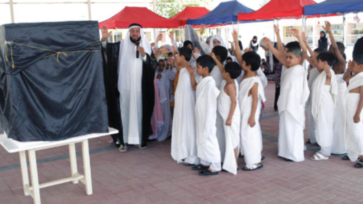 School kids perform the Hajj ritual in a show
