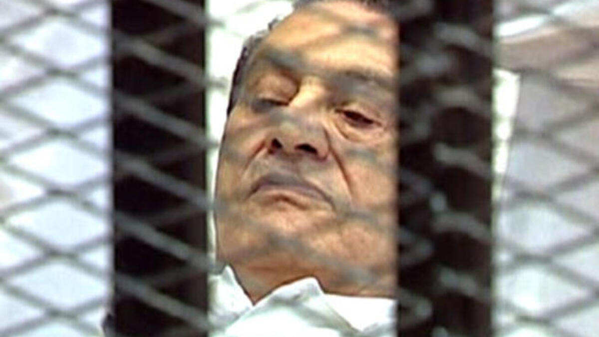 First outing to court, August 3rd, facing charges of conspiring to kill protesters: Mubarak presents a dramatic site for 
Tahrir eyes: Wheeled into court on a stretcher bed, in a metal cage, he is fitted out in
white pajamas, hospital gown and convalescent-like, a shadow of the Mubarak once-mighty,  now pale and meek, as the
patient-defendant..