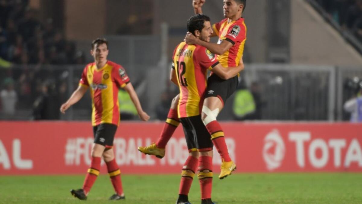 ES Tunis's forward Saad Beguir (up) celebrates after scoring a goal with ES Tunis' defender Khalil Chamam during the CAF Champions League second leg final football match between Egypt's Al-Ahly and Tunisia's ES Tunis at the Olympic stadium in Rades on November 9, 2018. Fethi Belaid / AFP