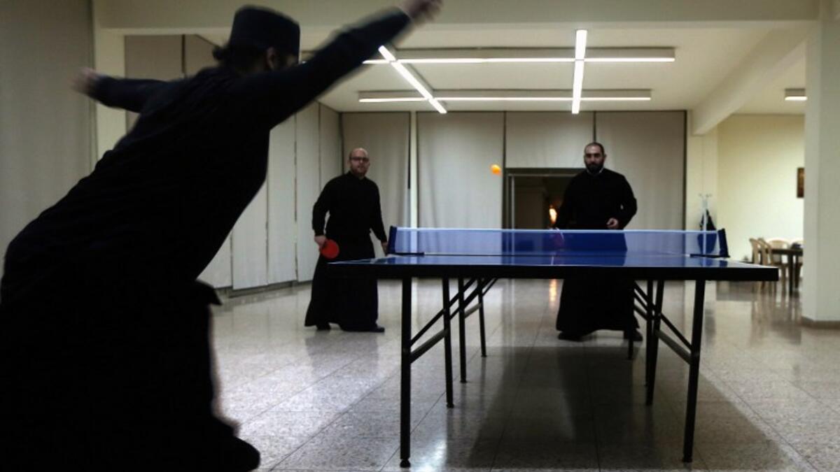 Greek Orthodox priests play tennis table during a break from their studies at the St. John of Damascus Institute of Theology in Balamand in northern Lebanon on March 2, 2016. The institute was established in 1832 and hosts students from all over the world.

PATRICK BAZ / AFP