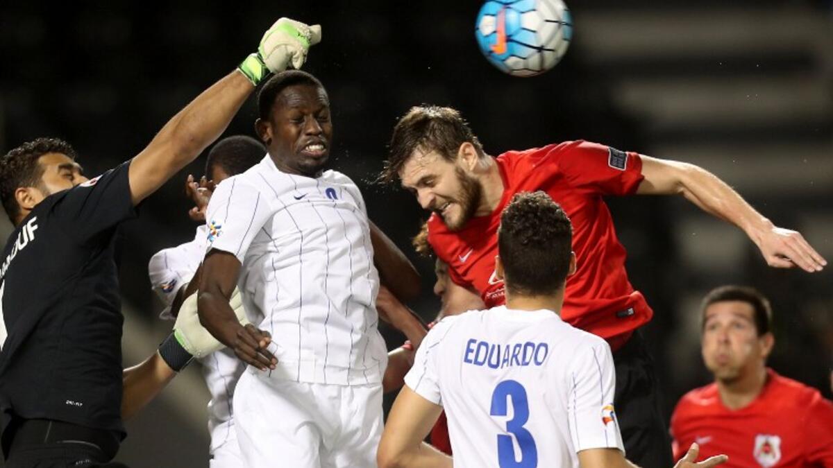 Al-Hilal's Abdulmalek Al Khaibri (L) fights for the ball against al-Rayyan's Nathan Otávio during a AFC Champions League match between Qatar's al-Rayyan and Saudi Arabia's al-Hilal at the Jassim Bin Hamad Stadium in Doha on March 8, 2017. Karim JAAFAR / AFP