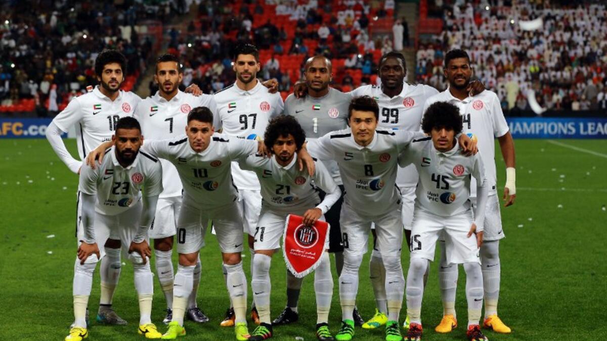 UAE's Al-Jazeera starting eleven pose for a team photo prior to the start of their AFC Champions League third round qualifying football match against Qatar's Al-Sadd club at the Mohammed Bin Zayed Stadium in Abu Dhabi on February 9, 2016.