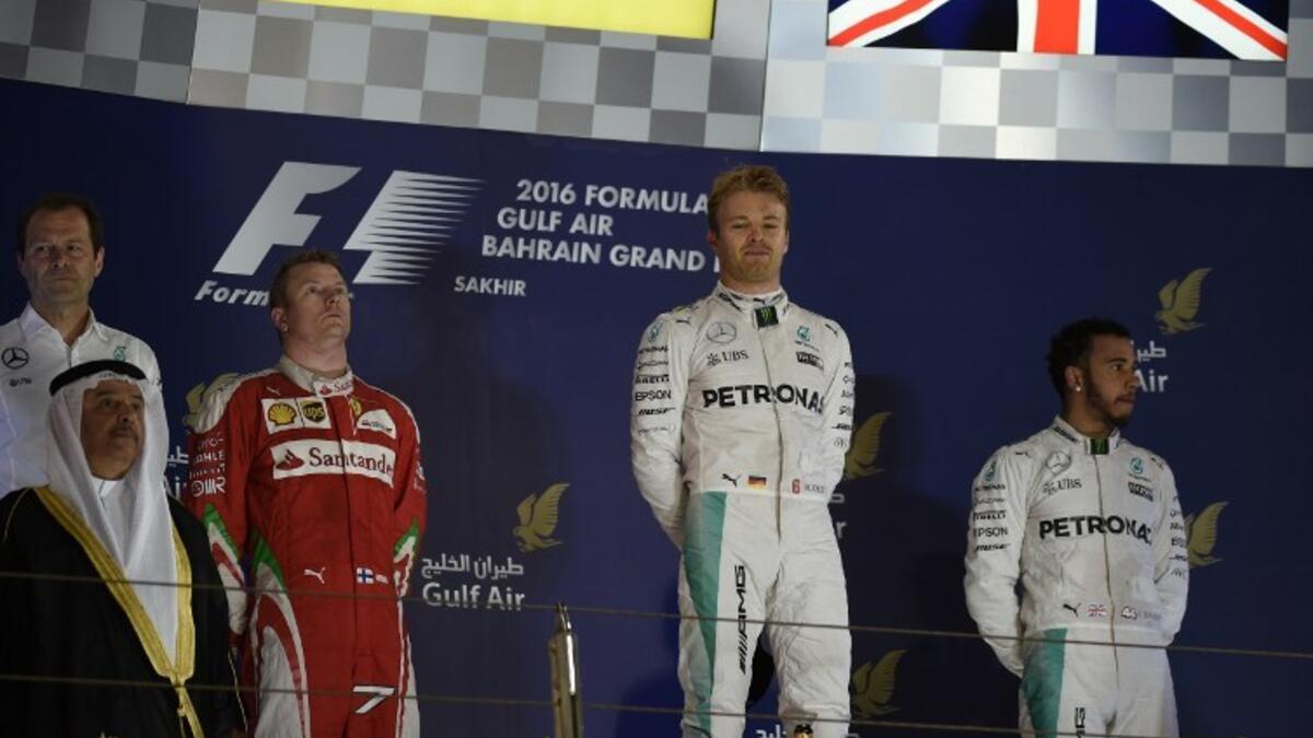 Mercedes AMG Petronas F1 Team's German driver Nico Rosberg (2nd R) celebrates after winning the Bahrain Formula 1 GP next to second placed Ferrari's Finnish driver Kimi Raikkonen (3rd L) and third placed Mercedes AMG Petronas F1 Team's British driver Lewis Hamilton (R) at the Sakhir circuit in Manama on April 3, 2016. AFP PHOTO / MOHAMMED AL-SHAIKH