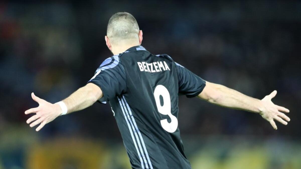 Real Madrid's French forward Karim Benzema celebrates after scoring a goal during the Club World Cup semi-final football match between Club America of Mexico and Real Madrid of Spain at Yokohama International stadium in Yokohama on December 15, 2016.
Behrouz MEHRI / AFP