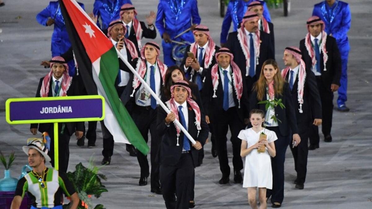Jordan's flagbearer Hussein Iashaish leads his delegation during the opening ceremony of the Rio 2016 Olympic Games at the Maracana stadium in Rio de Janeiro on August 5, 2016.
PEDRO UGARTE / AFP