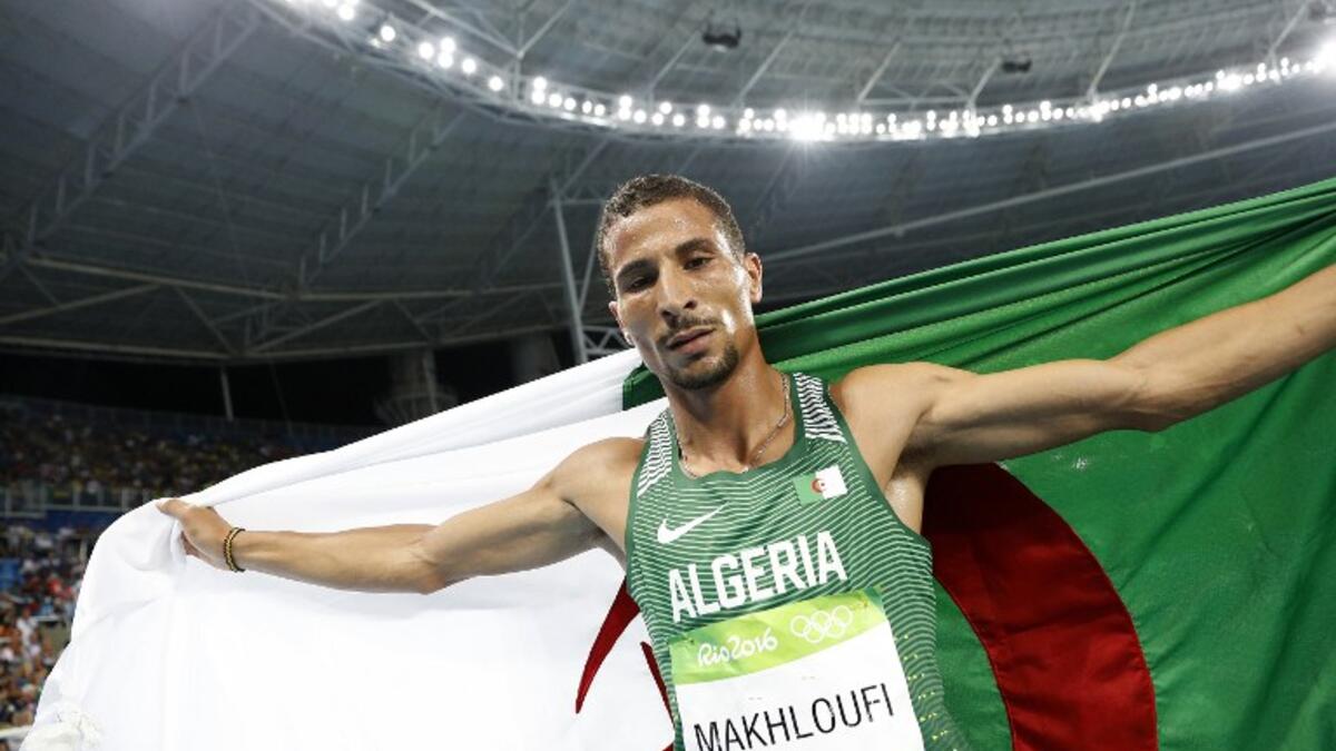 Algeria's Taoufik Makhloufi celebrates winning the silver medal in the Men's 1500m Final during the athletics event at the Rio 2016 Olympic Games at the Olympic Stadium in Rio de Janeiro on August 20, 2016.
Adrian DENNIS / AFP