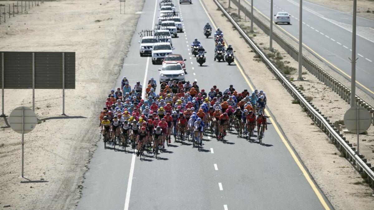 The pack rides on the highway during the second stage of the 2016 Tour of Qatar cycling race, starting and finishing at the Qatar University on February 9, 2016. Norway's Alexander Kristoff won a sprint finish ahead of Britain's Marc Cavendish in the second stage of the Tour of Qatar.
