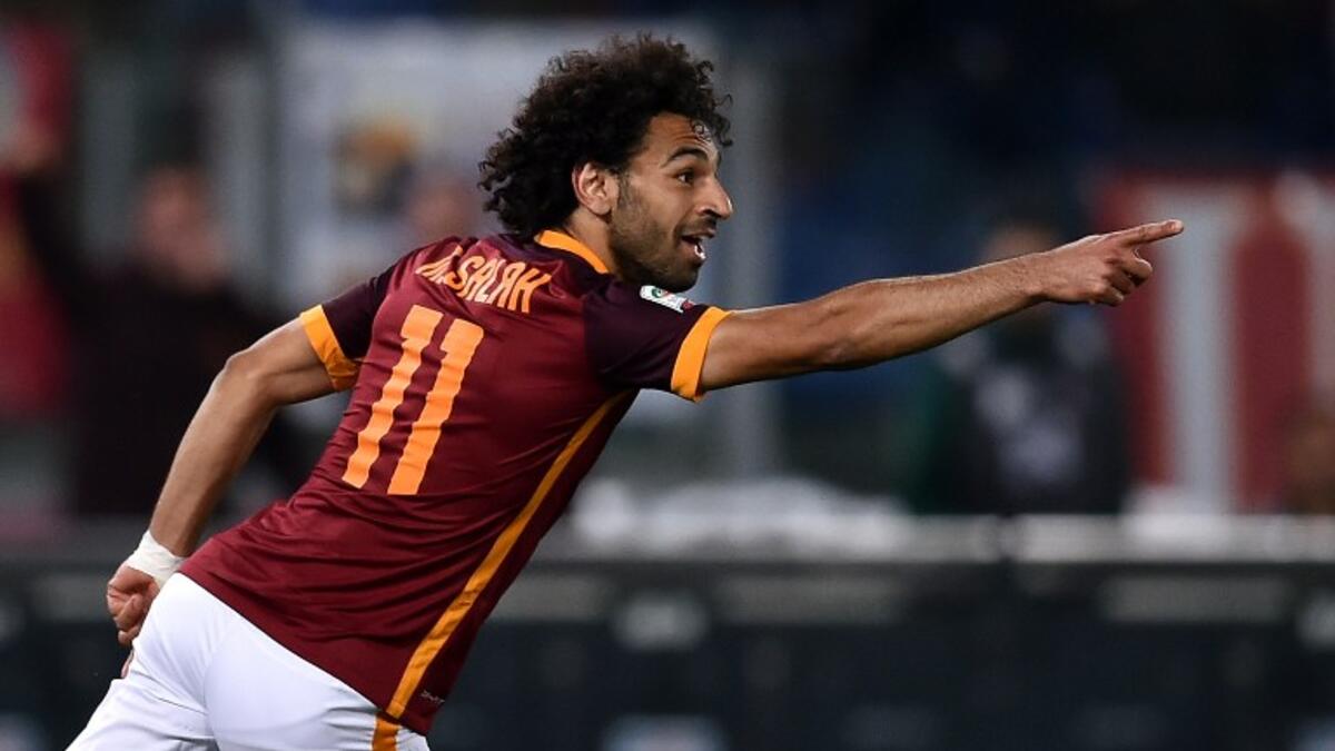 Roma's midfielder from Egypt Mohamed Salah celebrates after scoring during the Italian Serie A football match Roma vs Bologna on April 11, 2016 at Olympic stadium in Rome.
ALBERTO PIZZOLI / AFP