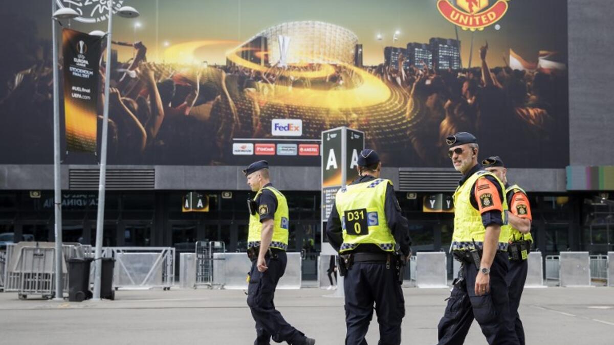Police patrol outside the Friends arena in Stockholm on May 23, 2017, on the eve of the UEFA Europa League football final between Ajax and Manchester United. Odd ANDERSEN / AFP